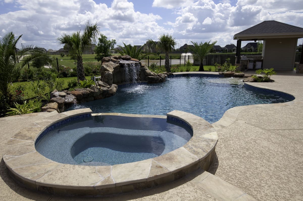 custom-designed pool, spa, waterfall, and patio cover